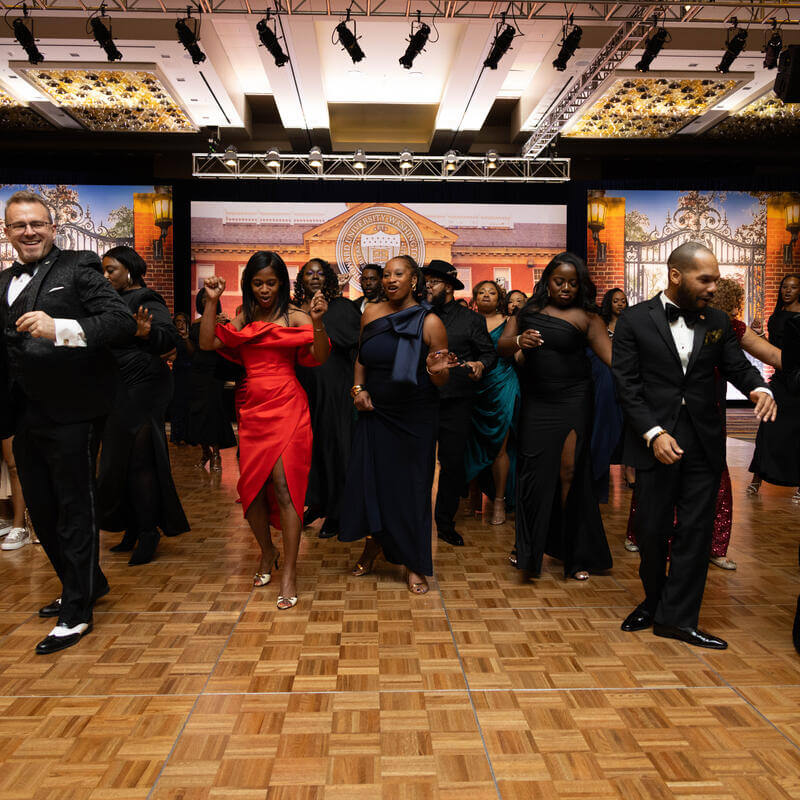 Charter Day Dinner guests dancing