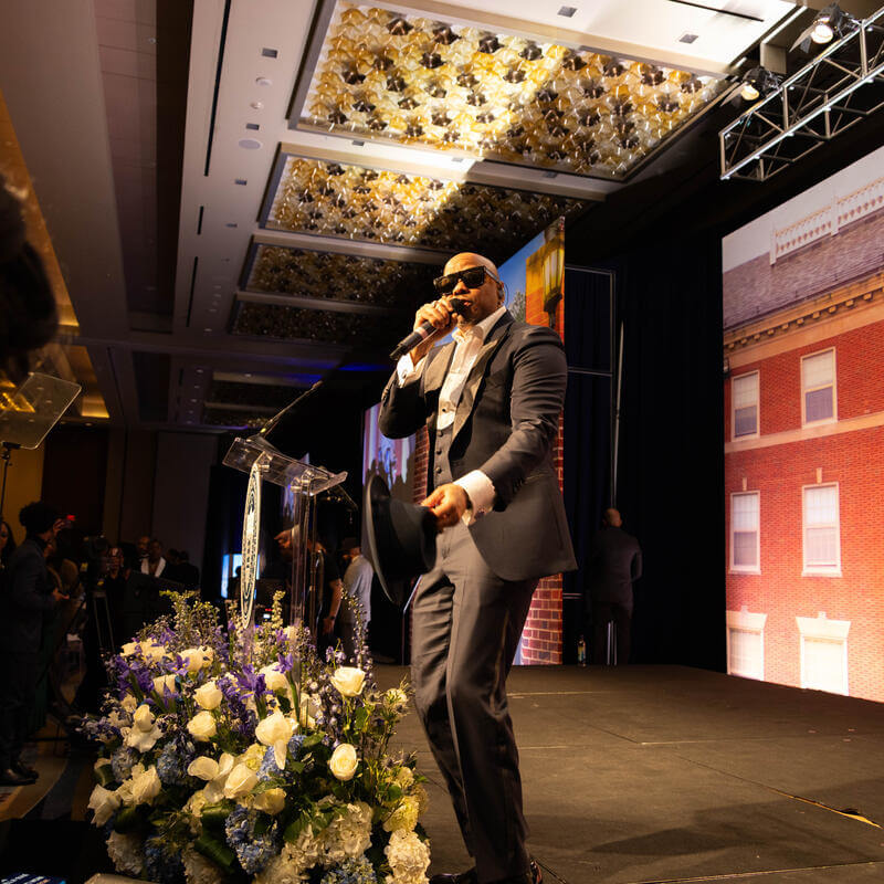 Charter Day Dinner host on stage