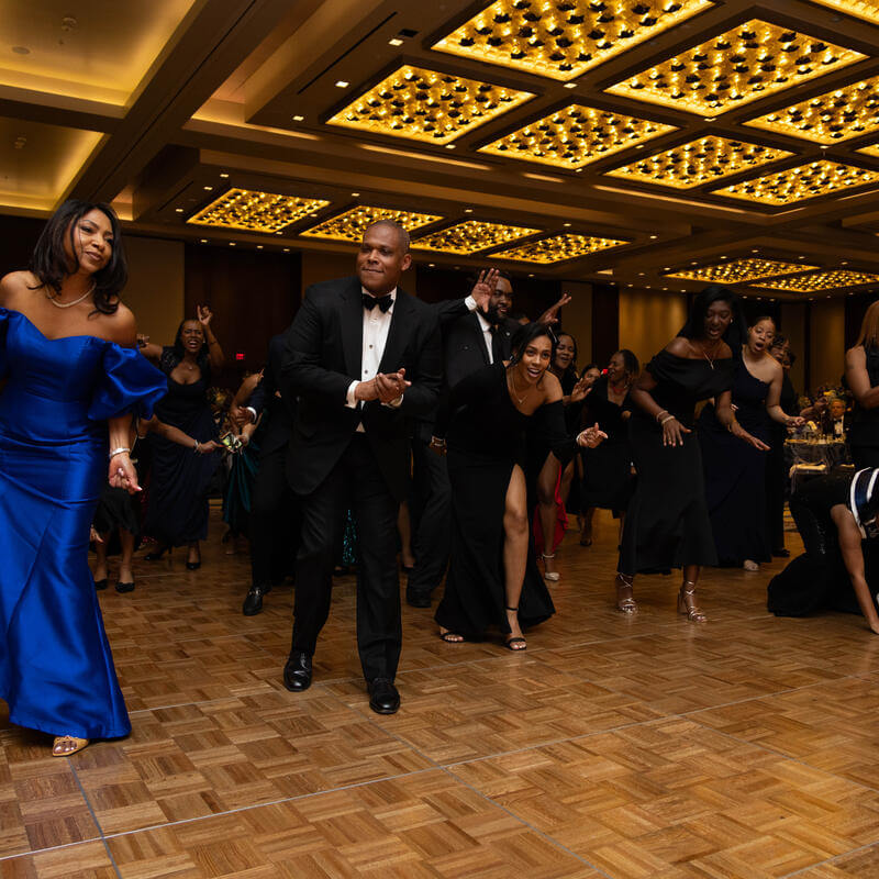 Charter Day Dinner guests dancing