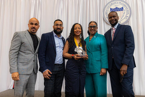 Dr. Young receiving her fundraising award